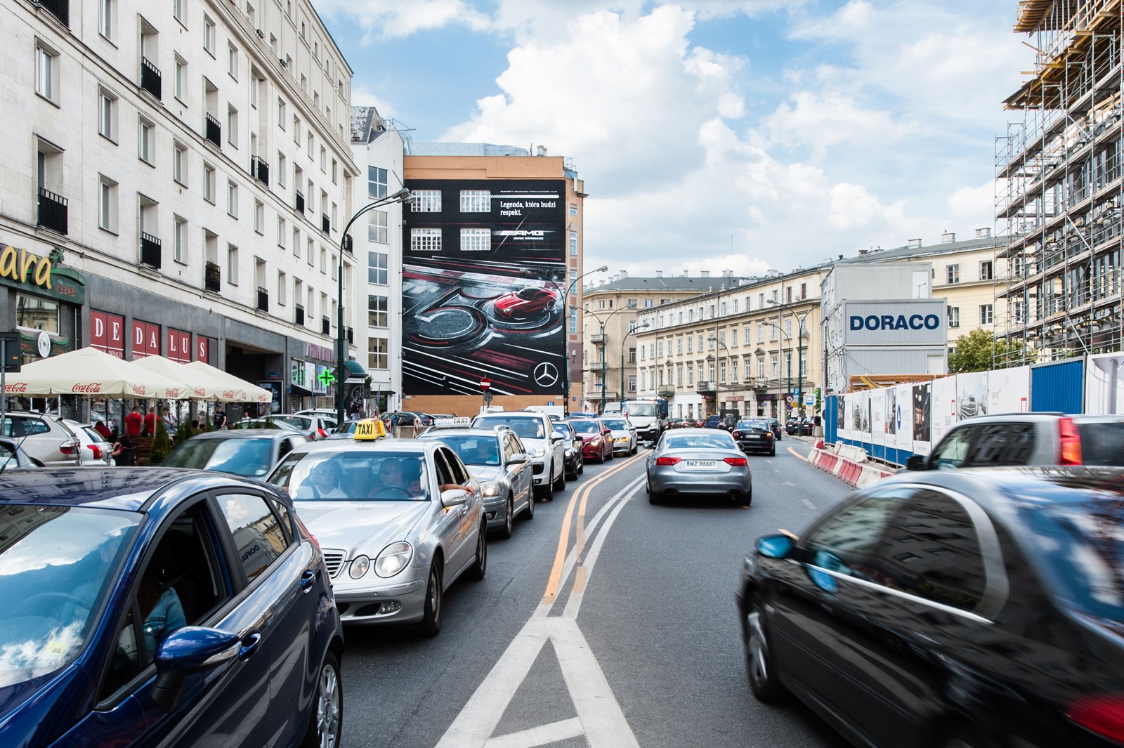 A view from Krucza street on Dom Towarowy Bracia Jablkowscy and a Mercedes AMG advertising mural | Mercedes AMG | Portfolio