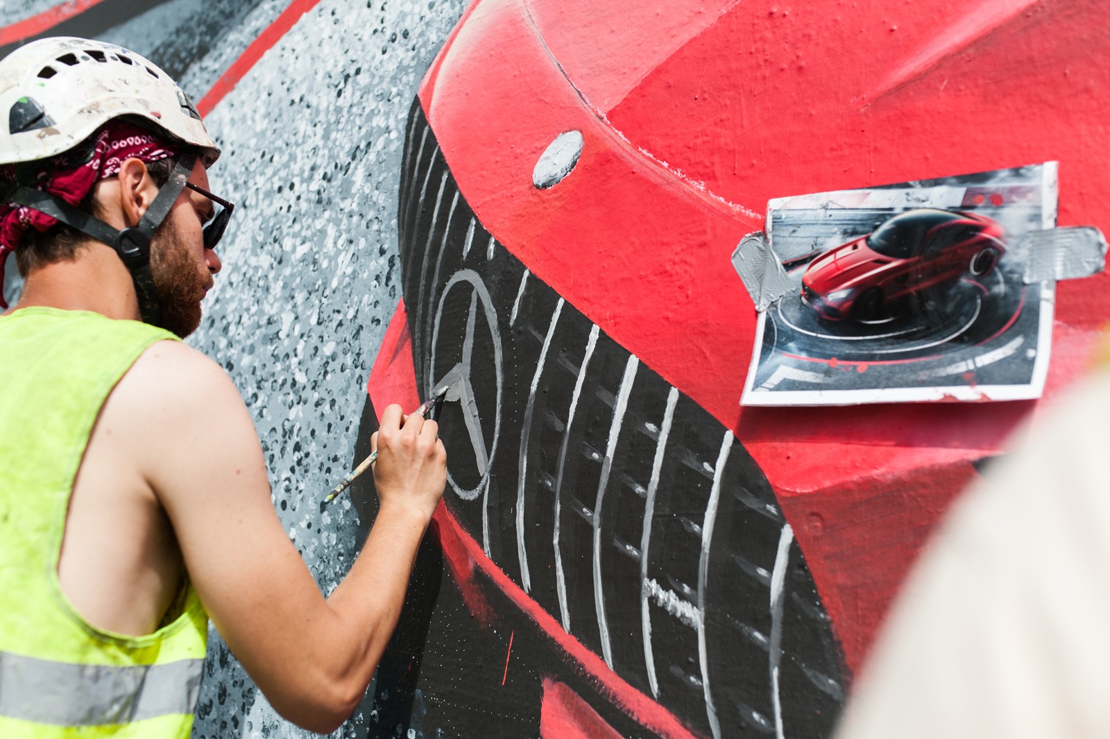 Artist painting a Mercedes AMG mural on Bracka street for Mercedes brand | Mercedes AMG | Portfolio