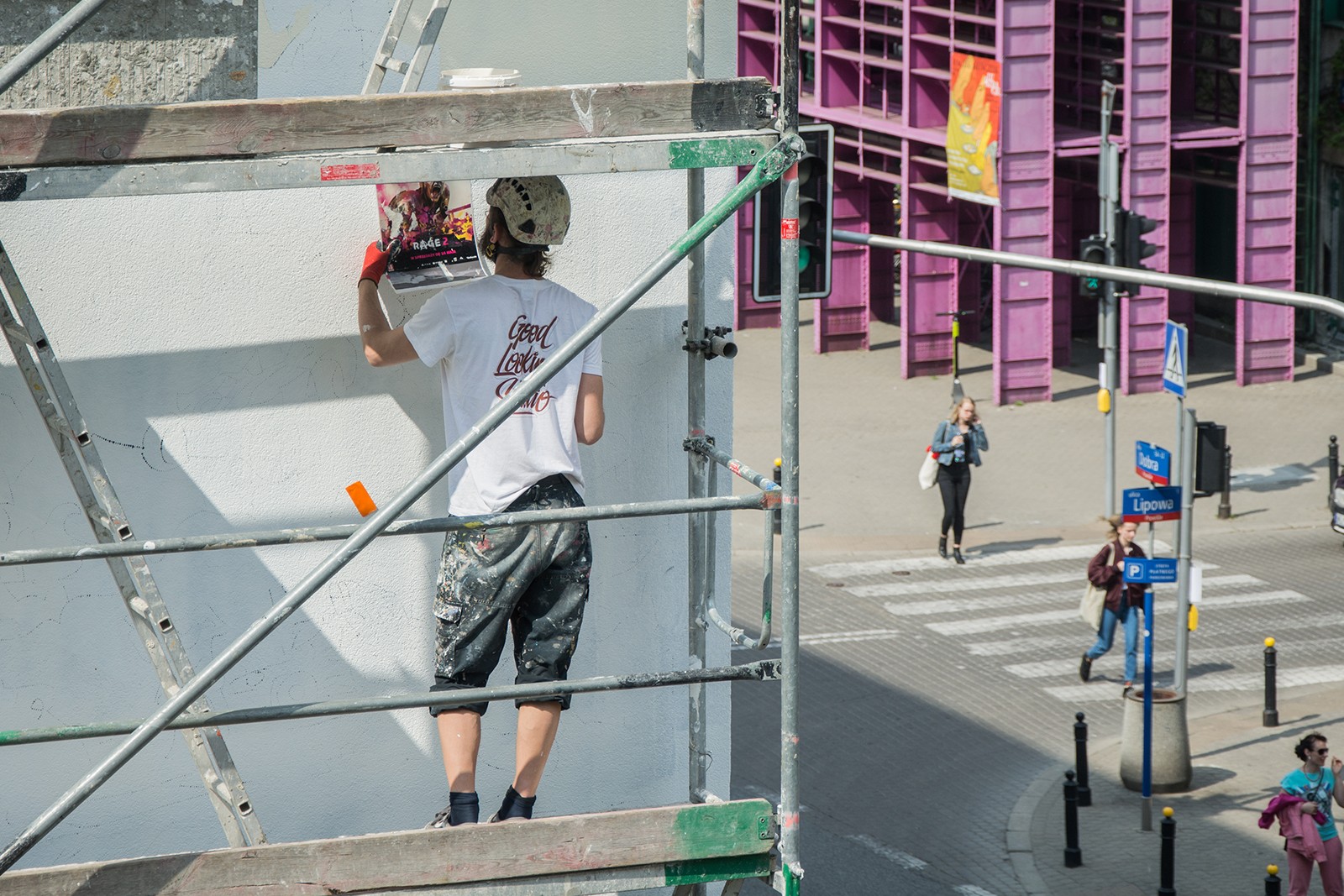 Artists paints advertisement mural Rage 2 near Dobra 53 street in Warsaw | Rage 2 | Portfolio
