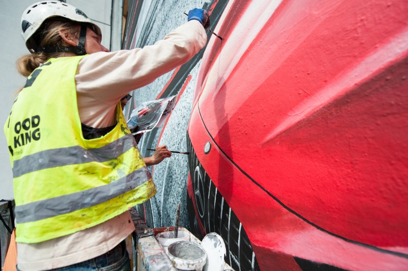 Mural being painted on a wall at the crossroads of Krucza and Bracka street for Mercedes-Benz Polska | Mercedes AMG | Portfolio
