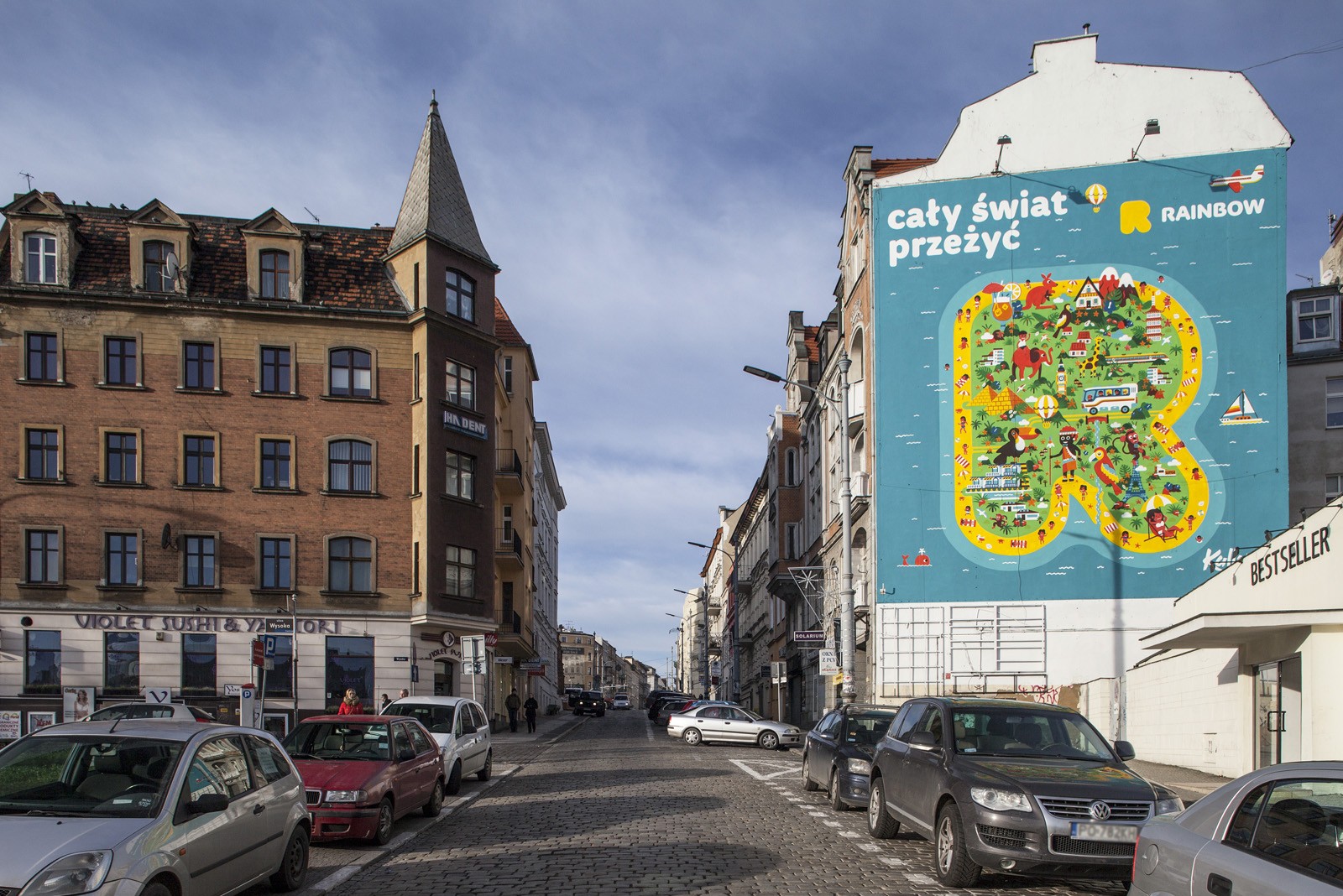 Mural reklamowy Rainbow w Poznaniu | The whole world experience | Portfolio
