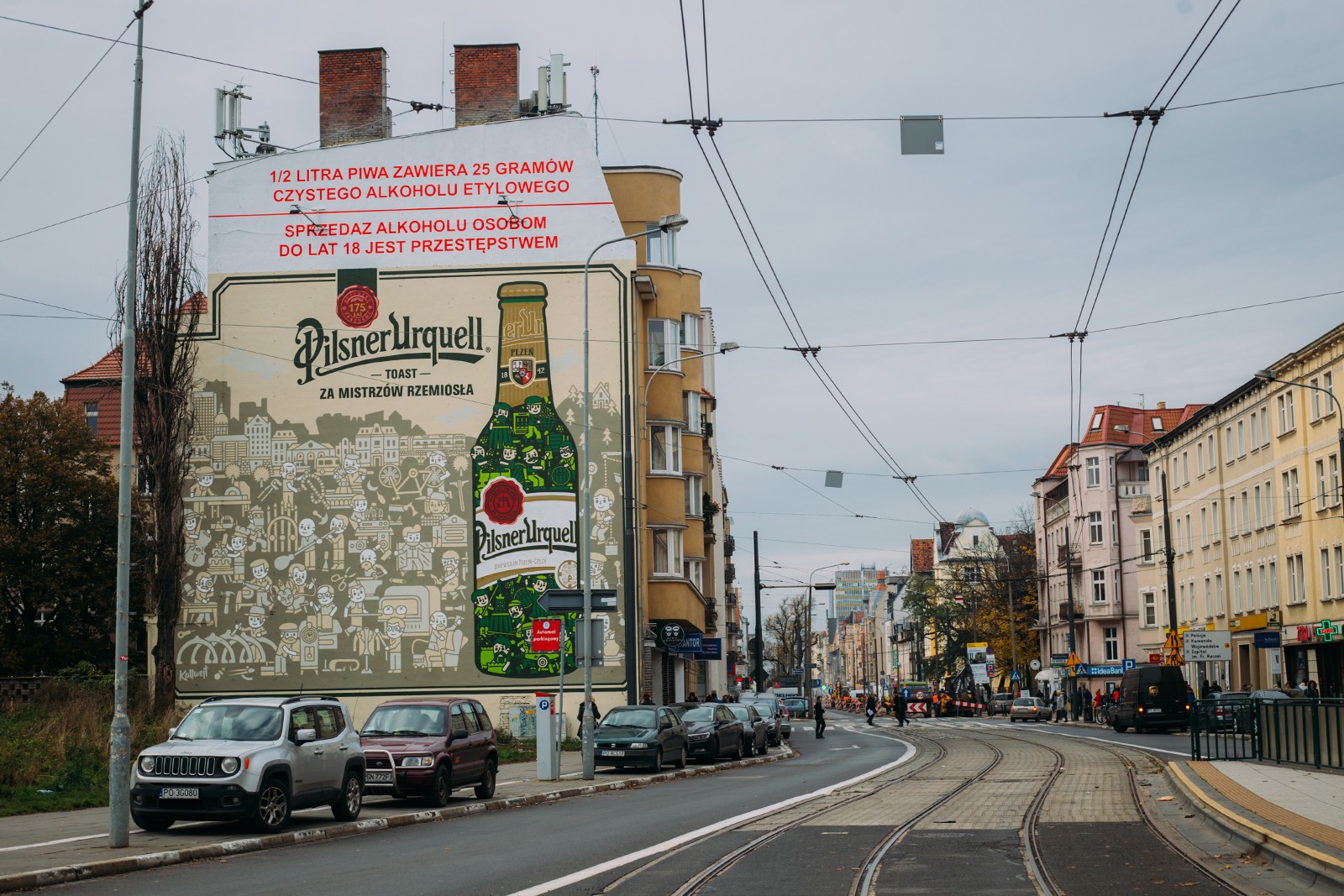 Mural reklamowy namalowany ręcznie za zamówienie Pilsner Urquell w Poznaniu przy ulicy Dąbrowskiego | Pilsner Urquell | Portfolio