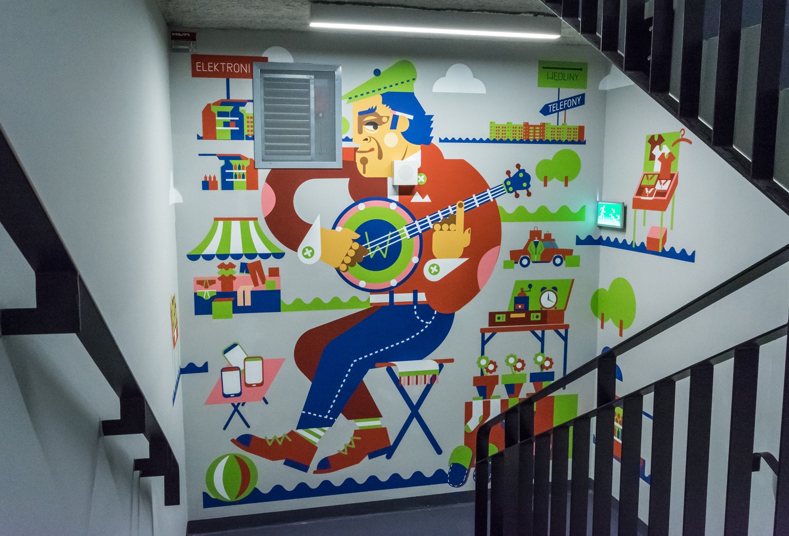 The interior of Q22 building with a mural painted for Deloitte | Malowanie na zlecenie Deloitte | Portfolio