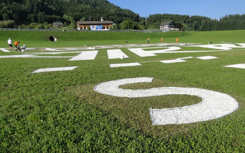 Typography handpainted on grass - Red Bull Air Race Spielberg Austria | Mural malowany na trawie - RedBull Air Race Austria | Portfolio