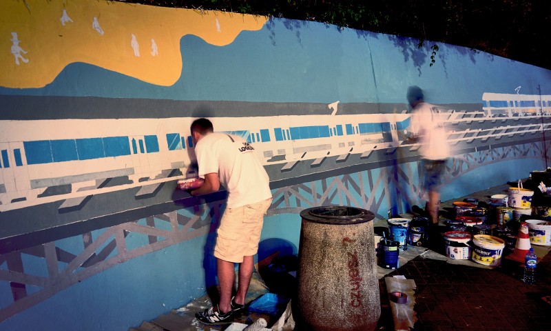 Painting mural on the wall near Centrum subway station for Samsung | Long live color! | Portfolio